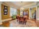 Traditional dining room featuring a dark wood table and beautiful chandelier lighting at 4128 Hunt Sw St, Covington, GA 30014