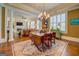 Traditional dining room featuring a dark wood table and beautiful chandelier lighting at 4128 Hunt Sw St, Covington, GA 30014