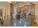 Gourmet kitchen featuring dark granite countertops, custom cabinets, and modern stainless steel appliances at 4128 Hunt Sw St, Covington, GA 30014
