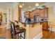 Stylish kitchen featuring a granite countertop bar with seating, modern appliances, and ample cabinet space at 4128 Hunt Sw St, Covington, GA 30014