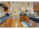 Traditional kitchen with stainless steel appliances, wood cabinets, and hardwood floors at 4128 Hunt Sw St, Covington, GA 30014