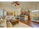 Open-concept design with a comfortable living area, dining space, and kitchen, ideal for entertaining guests at 4128 Hunt Sw St, Covington, GA 30014