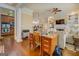 Open-concept living area featuring hardwood floors and a cozy fireplace at 4128 Hunt Sw St, Covington, GA 30014