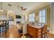 Open-concept living area featuring hardwood floors and a cozy fireplace at 4128 Hunt Sw St, Covington, GA 30014