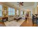 Spacious living room filled with natural light, showcasing a comfortable sectional sofa and elegant furnishings at 4128 Hunt Sw St, Covington, GA 30014