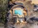 Aerial view of a community pool with lounge chairs, umbrellas, and a surrounding patio area at 4128 Hunt Sw St, Covington, GA 30014