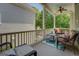 Inviting porch with wicker furniture, a ceiling fan, and views of the landscaped backyard at 4128 Hunt Sw St, Covington, GA 30014