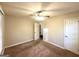 Spacious bedroom featuring carpet, neutral walls, and a ceiling fan for added comfort at 1901 Clarke Ln, Decatur, GA 30035