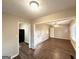Open-concept living space showcasing hardwood floors and neutral wall paint at 1901 Clarke Ln, Decatur, GA 30035