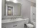 Bathroom features a white vanity, a stylish faucet, toilet and a shower-tub combo at 2894 Cushing Ct, Jonesboro, GA 30236