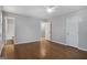 Spacious bedroom with hardwood flooring, ceiling fan and two entry doors at 2894 Cushing Ct, Jonesboro, GA 30236