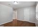 This bedroom has hardwood floors, white doors, and neutral walls at 2894 Cushing Ct, Jonesboro, GA 30236