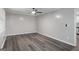 Bright bedroom with laminate flooring, ceiling fan and neutral walls at 2894 Cushing Ct, Jonesboro, GA 30236
