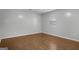 This bedroom features hardwood flooring, a window and neutral-colored walls at 2894 Cushing Ct, Jonesboro, GA 30236