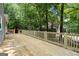 This deck has wooden railings and is surrounded by lush scenery at 2894 Cushing Ct, Jonesboro, GA 30236