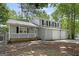 Beautiful home with gray siding, black shutters, white covered porch, and two-car garage at 2894 Cushing Ct, Jonesboro, GA 30236