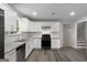 Modern kitchen featuring stainless steel appliances, granite countertops, and white cabinetry at 2894 Cushing Ct, Jonesboro, GA 30236