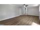 Hardwood floor living room features a fan and stairs at 2894 Cushing Ct, Jonesboro, GA 30236
