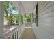 Covered porch with white railing offers serene outdoor space and natural light at 2894 Cushing Ct, Jonesboro, GA 30236