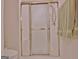 A full bathroom with glass shower door, linen closet and bench at 150 Butterton Ct, Fayetteville, GA 30214