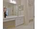 Bright bathroom featuring double vanity with white cabinets, and a shower at 150 Butterton Ct, Fayetteville, GA 30214