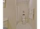 Bathroom featuring a toilet and shower with white towels and accents at 150 Butterton Ct, Fayetteville, GA 30214