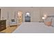This is a primary bedroom with a queen bed, accent chair, and a full ensuite bath at 150 Butterton Ct, Fayetteville, GA 30214