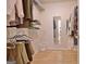 Walk-in closet featuring custom shelving, hanging rods, and clothing at 150 Butterton Ct, Fayetteville, GA 30214