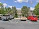 Community clubhouse with ample parking, flag pole, and well-kept landscaping at 150 Butterton Ct, Fayetteville, GA 30214