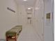 Hallway with tile floors, coat rack, bench, and closet space at 150 Butterton Ct, Fayetteville, GA 30214