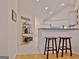Kitchen area with white cabinets, bar seating, and stainless steel appliances at 150 Butterton Ct, Fayetteville, GA 30214