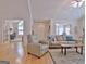 Spacious living room with hardwood floors, comfortable sofas, and ample natural light, perfect for relaxation at 150 Butterton Ct, Fayetteville, GA 30214
