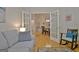Inviting living room featuring hardwood floors and french doors leading to the dining area at 150 Butterton Ct, Fayetteville, GA 30214