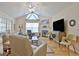 Living room featuring a fireplace, vaulted ceilings, and comfortable seating arrangement with hardwood floors at 150 Butterton Ct, Fayetteville, GA 30214