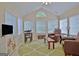 Relaxing sun room with ample natural light, comfortable seating, and a serene atmosphere at 150 Butterton Ct, Fayetteville, GA 30214