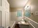 Bright bathroom featuring vanity with granite countertop and tile flooring at 2159 Holly Hill Dr, Decatur, GA 30032