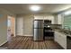 Well-equipped kitchen with stainless steel appliances and white cabinets at 2159 Holly Hill Dr, Decatur, GA 30032