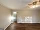 Bright living room featuring hardwood floors, neutral walls, and a ceiling fan at 2159 Holly Hill Dr, Decatur, GA 30032