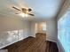Living room with hardwood floors, natural light, and open access to the dining area at 2159 Holly Hill Dr, Decatur, GA 30032
