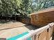Backyard view showing the deck, the home's exterior, a fenced yard, and a patio area at 224 Potts Se Rd, Conyers, GA 30094