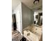 Clean bathroom with a soaking tub, modern fixtures, and wood-look flooring at 224 Potts Se Rd, Conyers, GA 30094