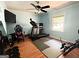 Bedroom with exercise equipment, and natural light streaming through the window at 224 Potts Se Rd, Conyers, GA 30094