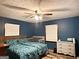 Comfortable bedroom with hardwood floors, ceiling fan, and two windows for natural light at 224 Potts Se Rd, Conyers, GA 30094