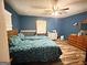 Cozy bedroom with wood-look flooring and a window allowing for natural light at 224 Potts Se Rd, Conyers, GA 30094
