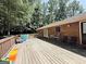 Large wooden deck perfect for outdoor entertaining surrounded by a lush, wooded backyard at 224 Potts Se Rd, Conyers, GA 30094