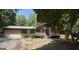 Charming one-story home featuring a covered front porch and an attached two-car garage at 224 Potts Se Rd, Conyers, GA 30094