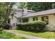 Exterior of home with lush landscaping and a manicured lawn with mature shrubbery at 3308 Quail Sw Run, Marietta, GA 30008