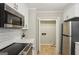 Close up of the stainless microwave and oven appliances in the updated kitchen at 3308 Quail Sw Run, Marietta, GA 30008