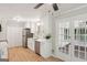 Updated kitchen with stainless steel appliances, quartz countertops, and access to the outdoor deck at 3308 Quail Sw Run, Marietta, GA 30008