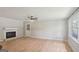 Bright and airy living room features hardwood floors, a fireplace, and large windows with natural light at 3308 Quail Sw Run, Marietta, GA 30008